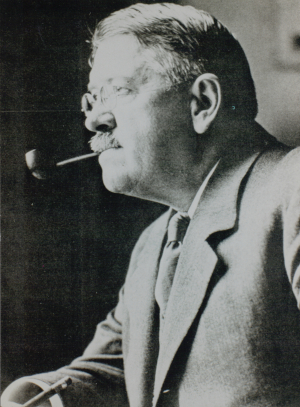 black and white profile of George Reisner, ARCE founder and archaeologist, with his pipe