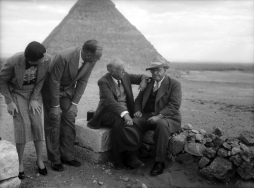 old black and white photograph of Joseph Lindon Smith and George Reisner, plus another unknown man and an unknown woman, in front of the Giza Pyramids